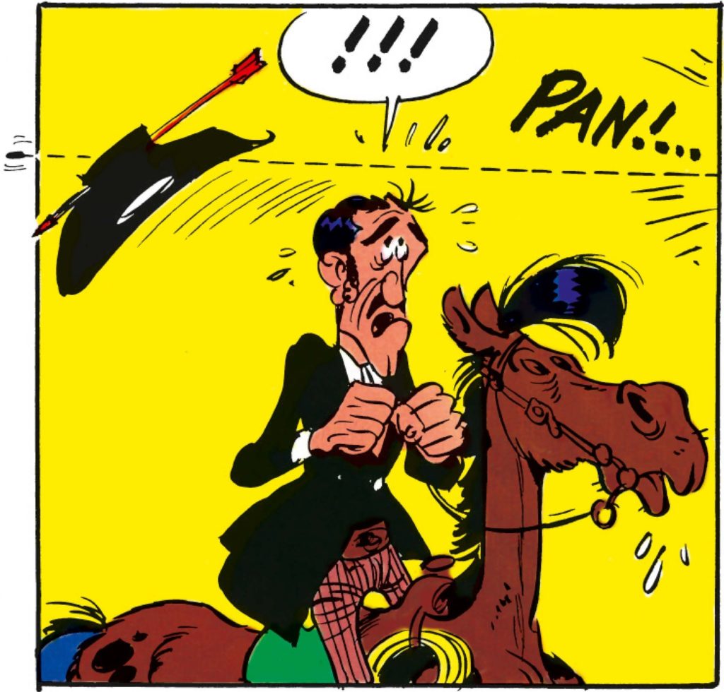 Cowboy riding a horse, his hat is shot off by an arrow